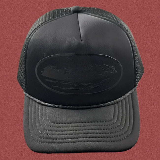 Cortiez All-Black Monochromatic Oval Ship Logo Trucker Hat Hover Image